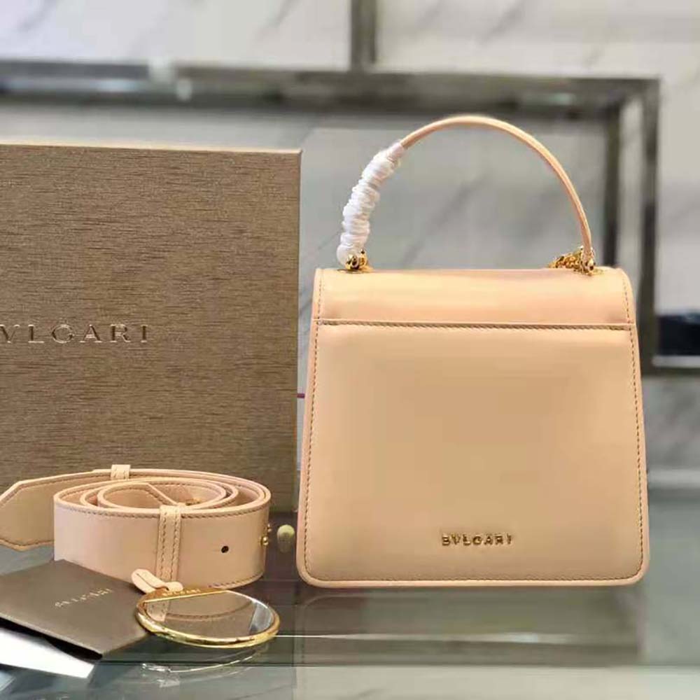 Side angle showing gold-tone hardware on pink Bvlgari Serpenti Forever bag