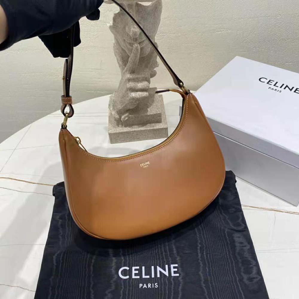 Side profile showing compact silhouette of Celine Women AVA Bag in tan-brown