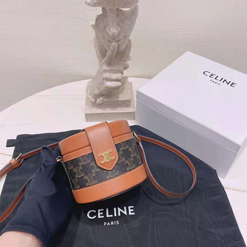 Side view showing smooth calfskin and structured silhouette of Celine Small Tambour Bag