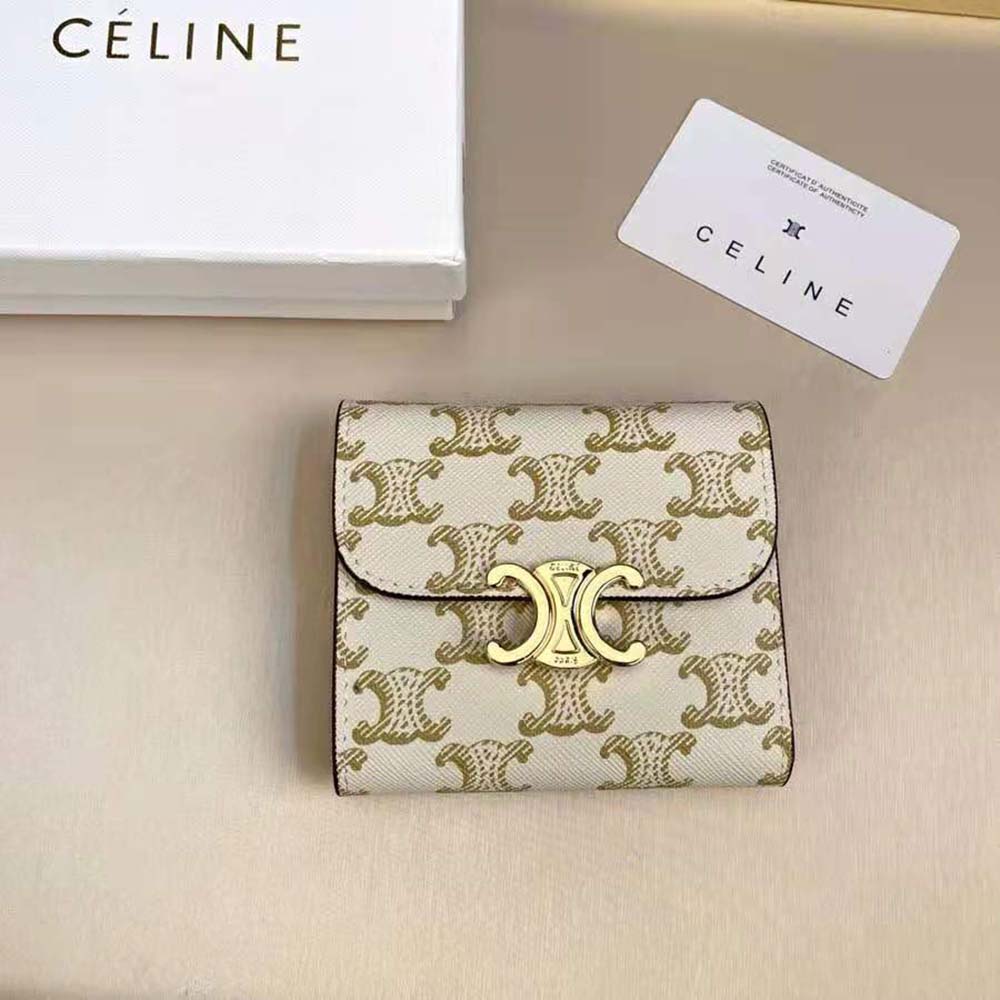 Close-up of gold-tone Triomphe hardware on Celine wallet