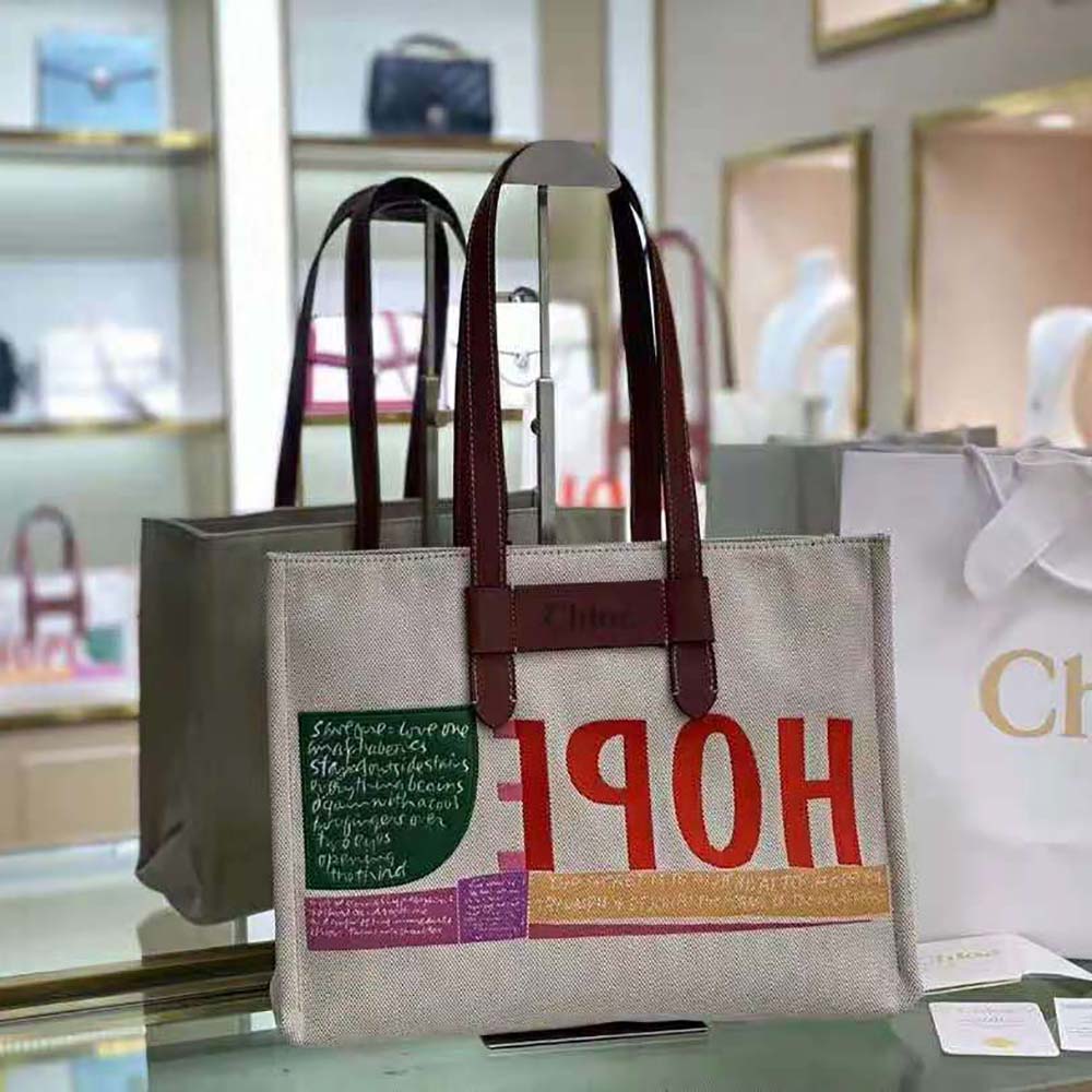 Close-up of embroidered artwork and shiny calfskin on Chloe Women Corita Kent Large Tote