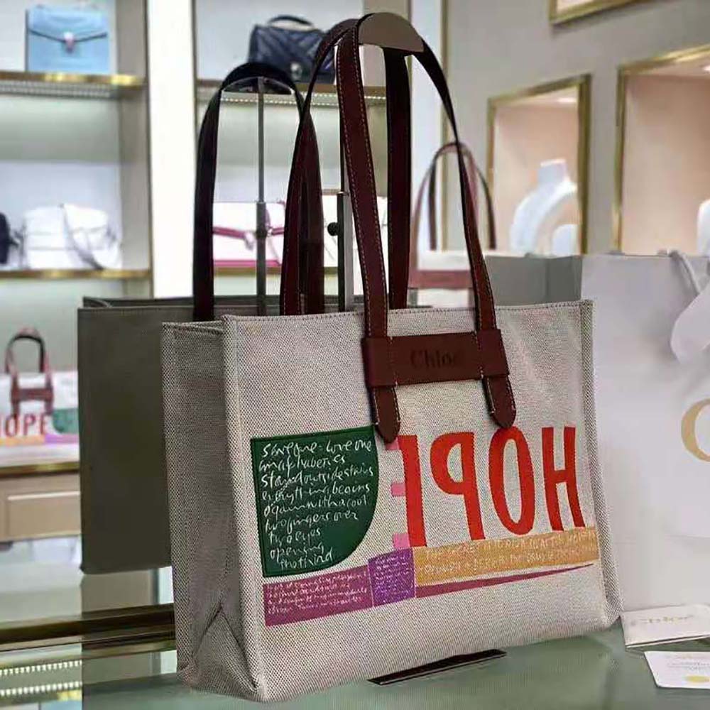 Side profile showing gold hardware and large tote silhouette of Chloe Women Corita Kent Large Tote