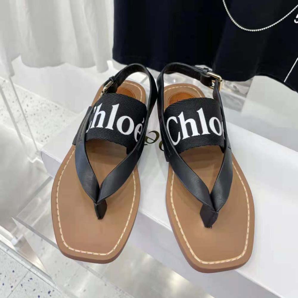 Top-down view showing flat silhouette and canvas upper of sandal