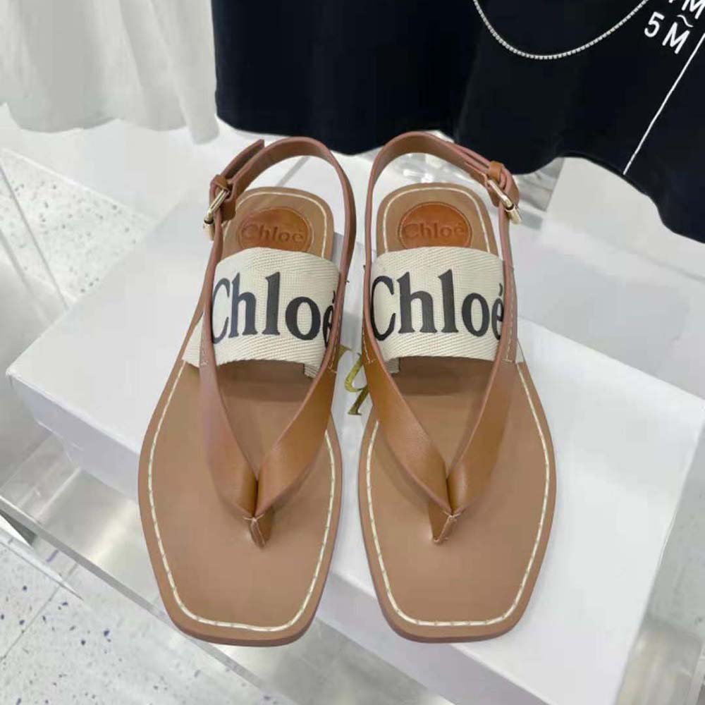 Close-up of gold-tone hardware on Chloe Women Woody Flat Sandal