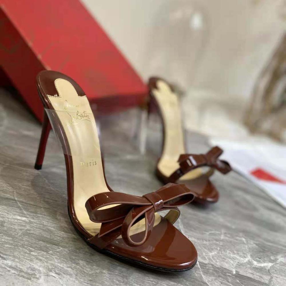 Close-up on maroon leather and ankle strap of Christian Louboutin Women Just Nodo 85 mm Heel-Maroon