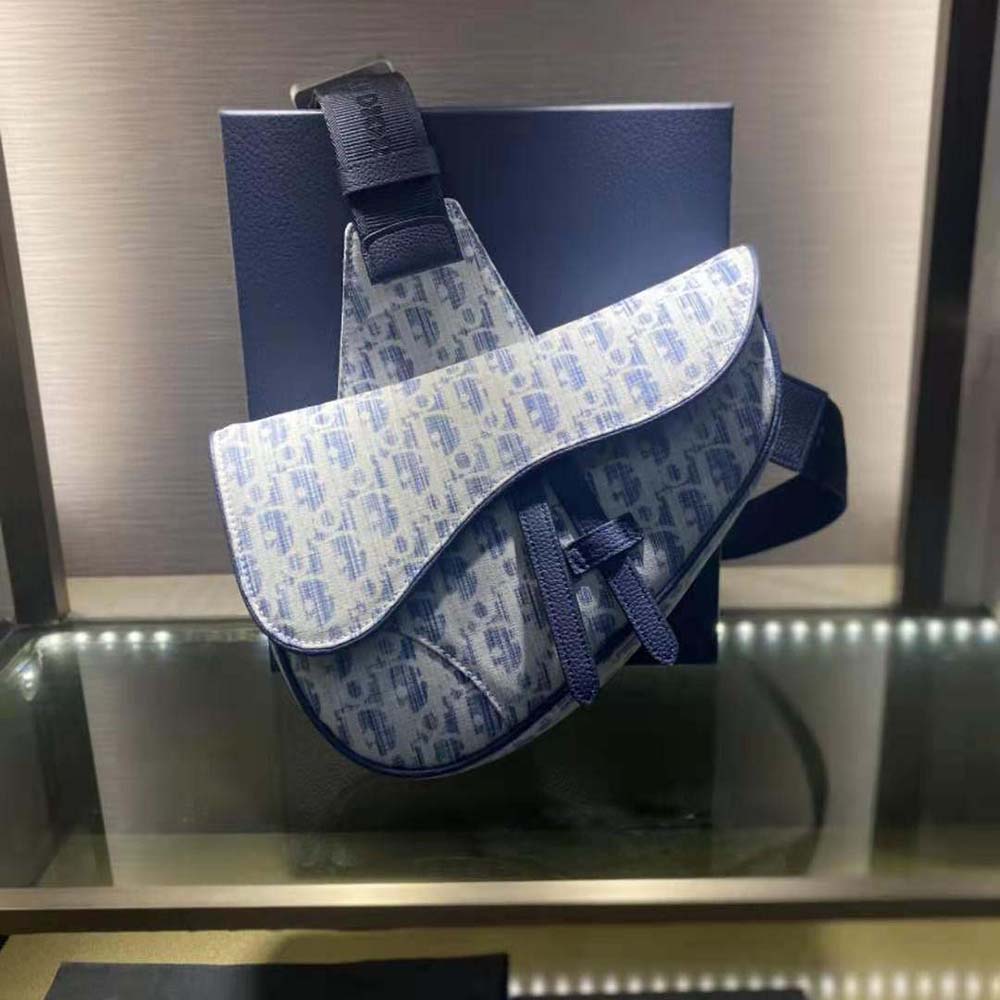 Close-up on silver-tone Dior Oblique hardware and flap closure