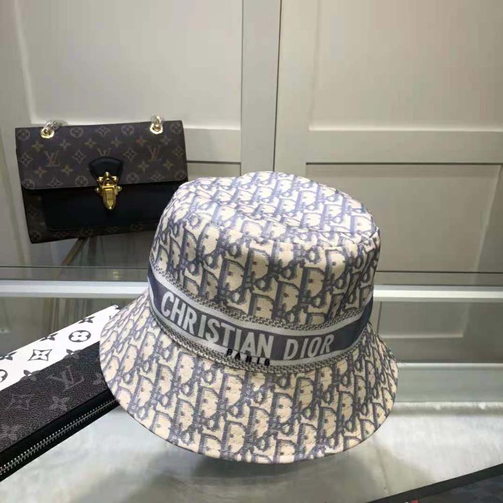 Side angle showing small brim on Dior Women D-oblique bucket hat