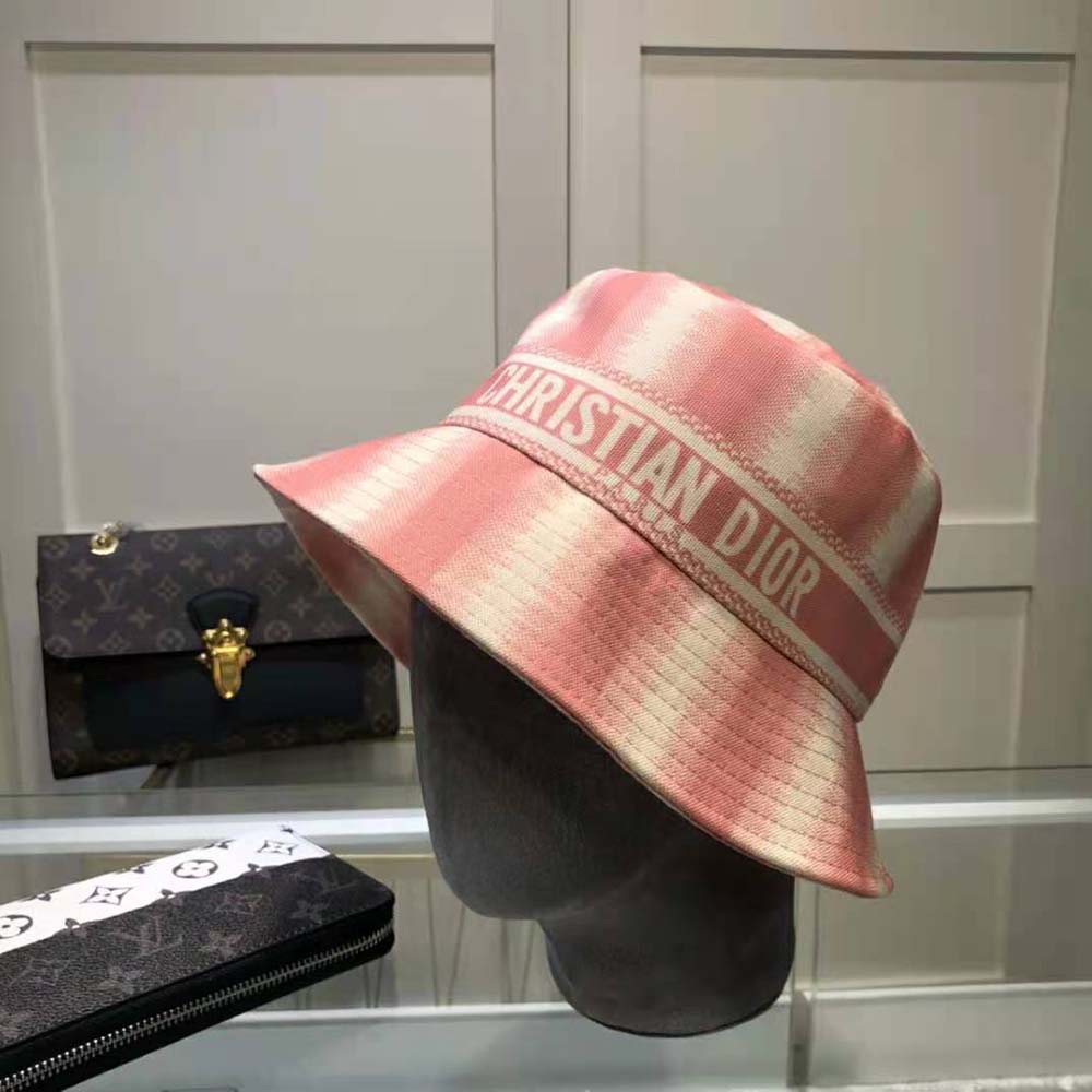 Close-up on pink cotton fabric and D-stripes embroidery detail