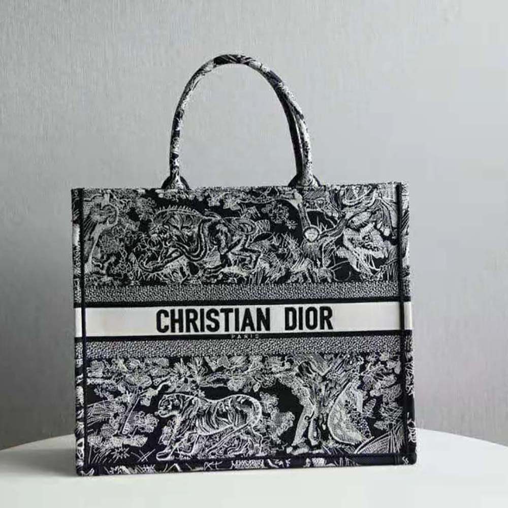 Close-up of navy reverse embroidery detail on Dior Book Tote