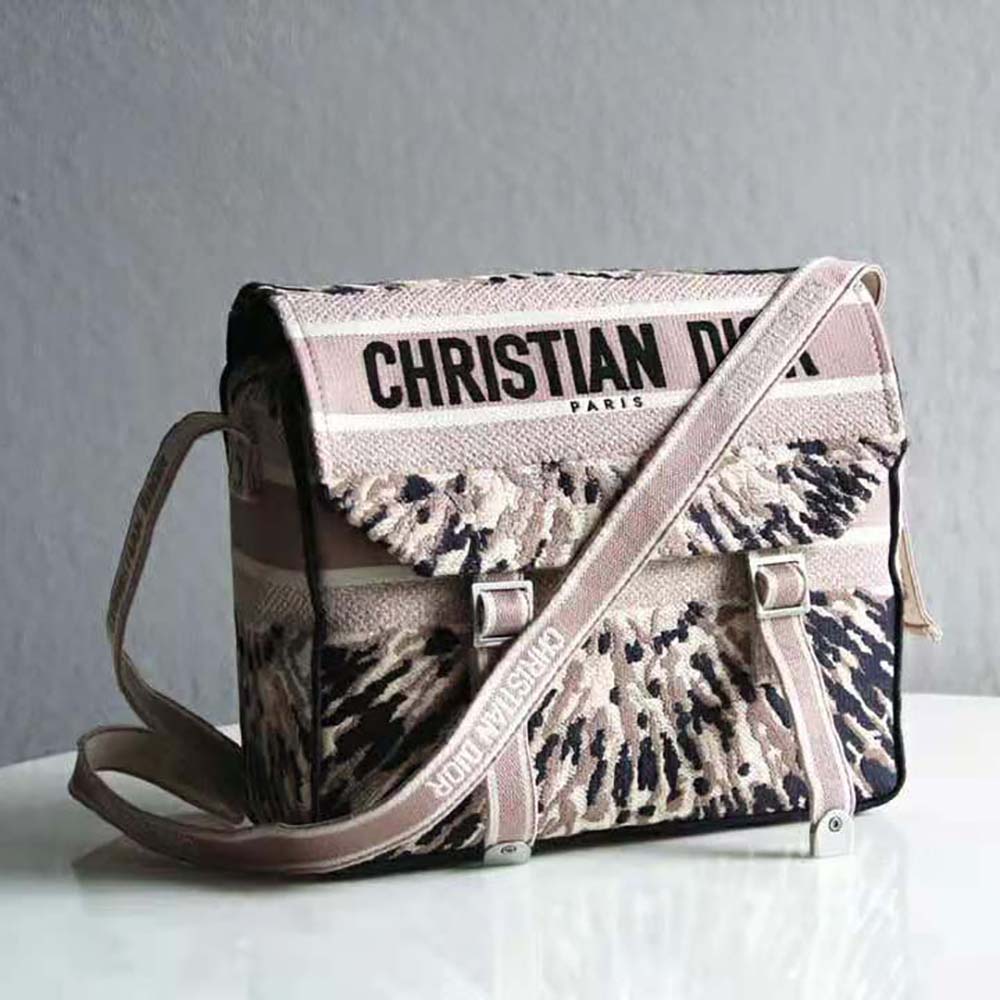 Close-up on Dior embroidery and multicolor tie design detail on Dior Women Diorcamp Bag