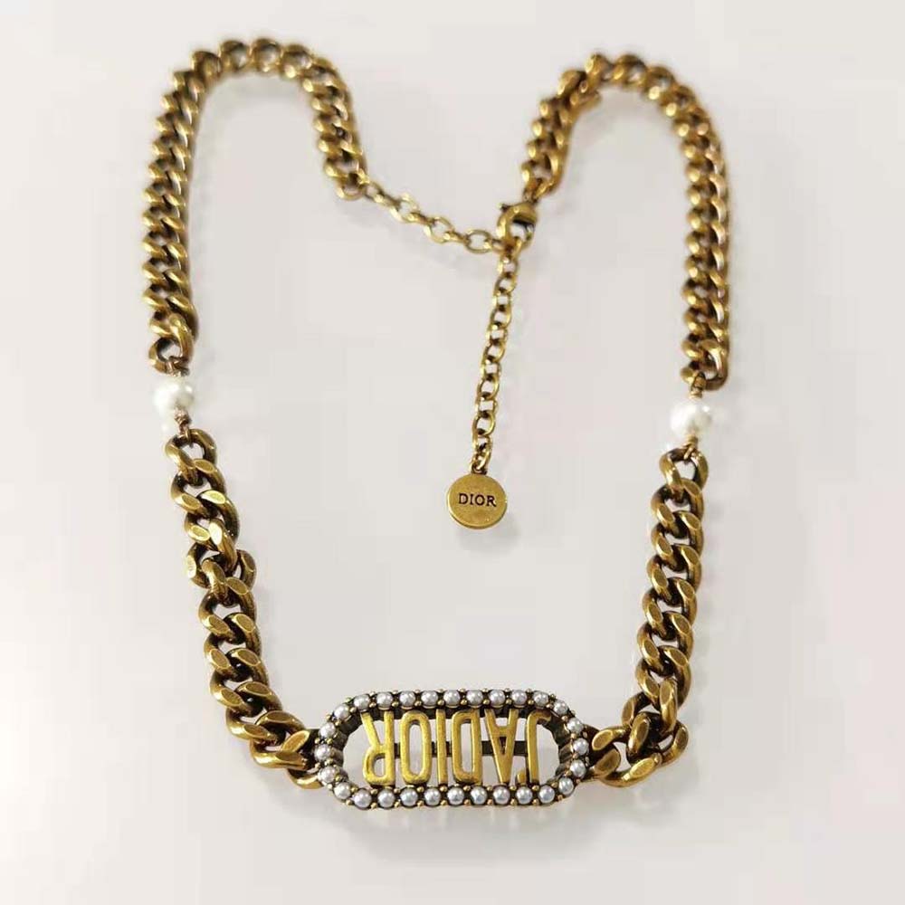 Styled shot of Dior Women J Adior Choker highlighting rich gold finish