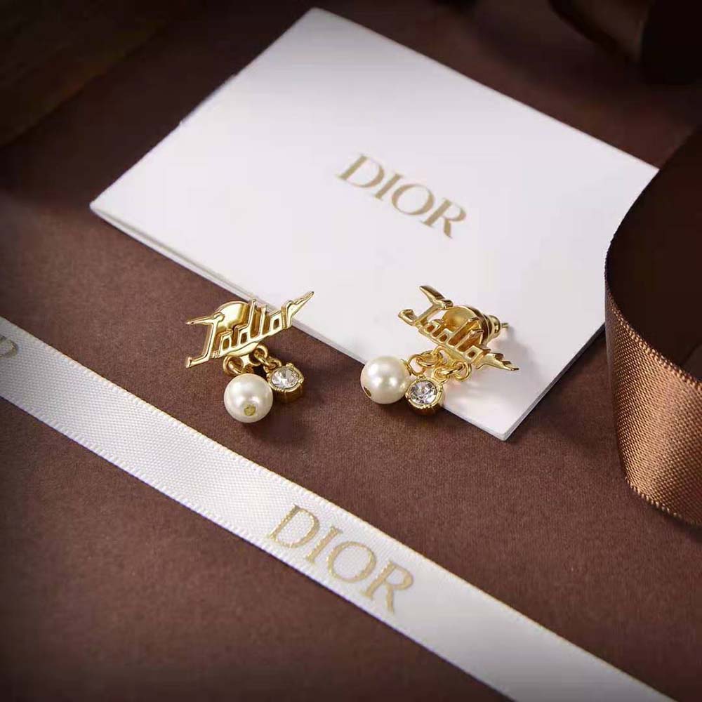 Side angle showing gold-finish and post closure of Dior Women J’Adior Earrings