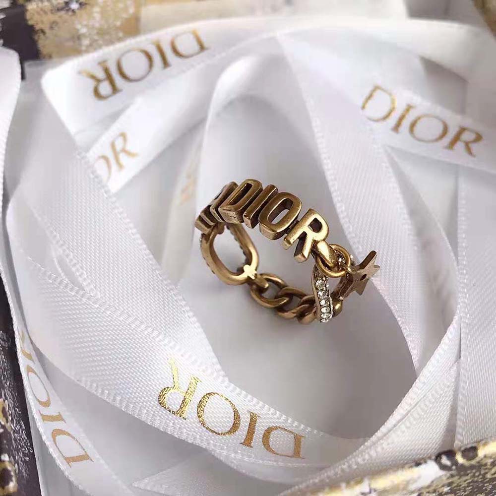 Dior Women J’Adior Ring displayed on model’s hand, highlighting gold finish