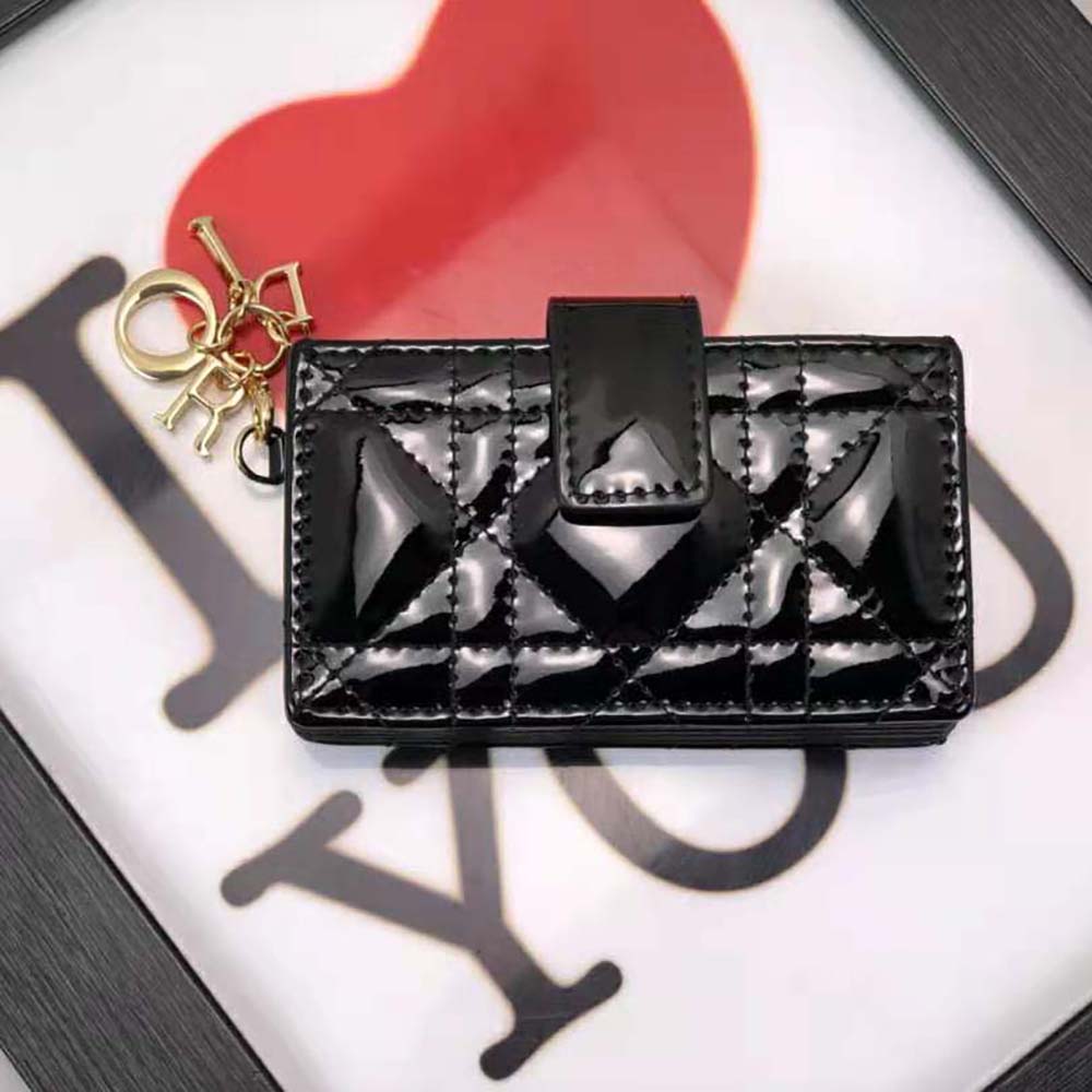 Close-up of gold hardware and Cannage stitching on Dior card holder