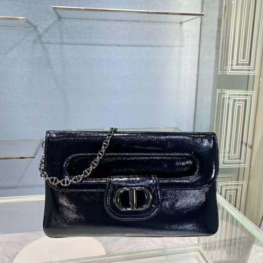 Close-up of gold Dior hardware on Black Crinkled Patent Lambskin bag