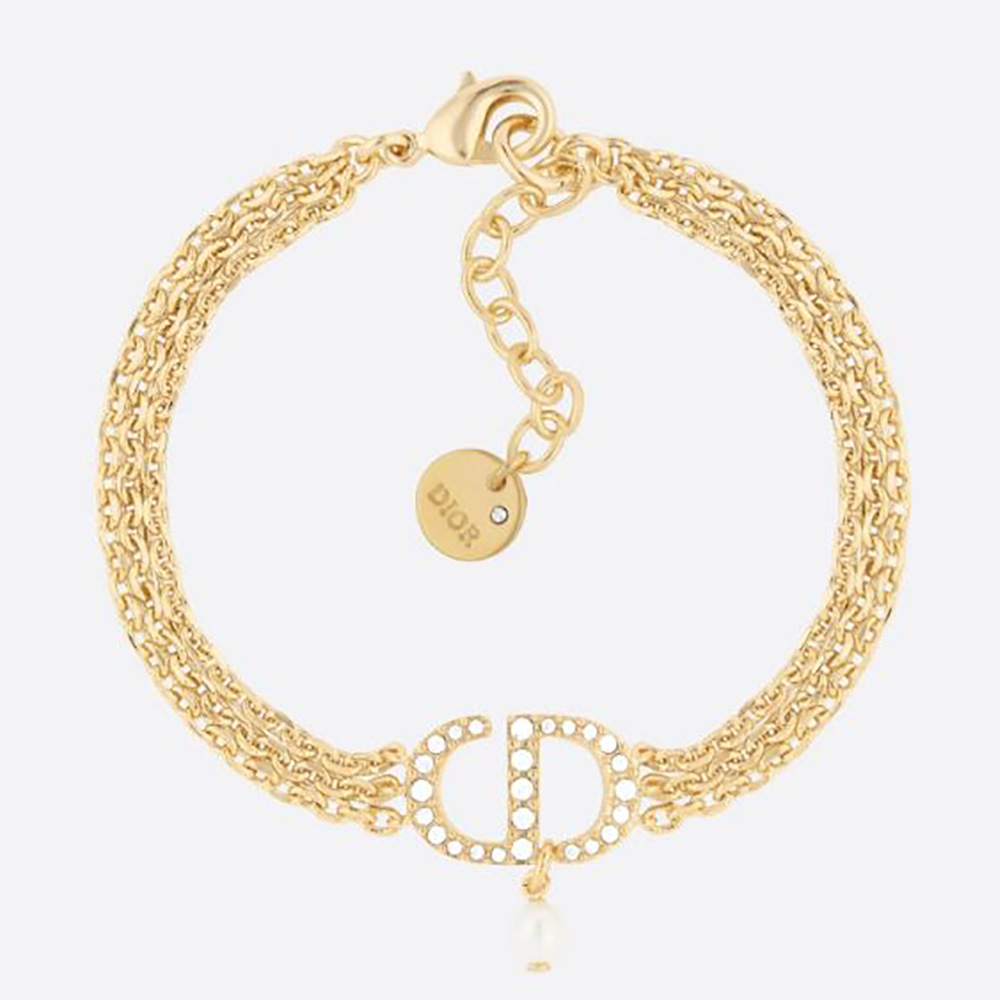 Close-up of Dior Women Multi-chain Petit CD Bracelet Gold-Finish Metal charm detail