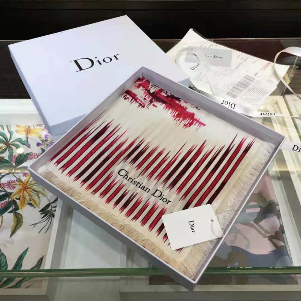 Close-up of silk twill texture and Dior logo on Burgundy scarf