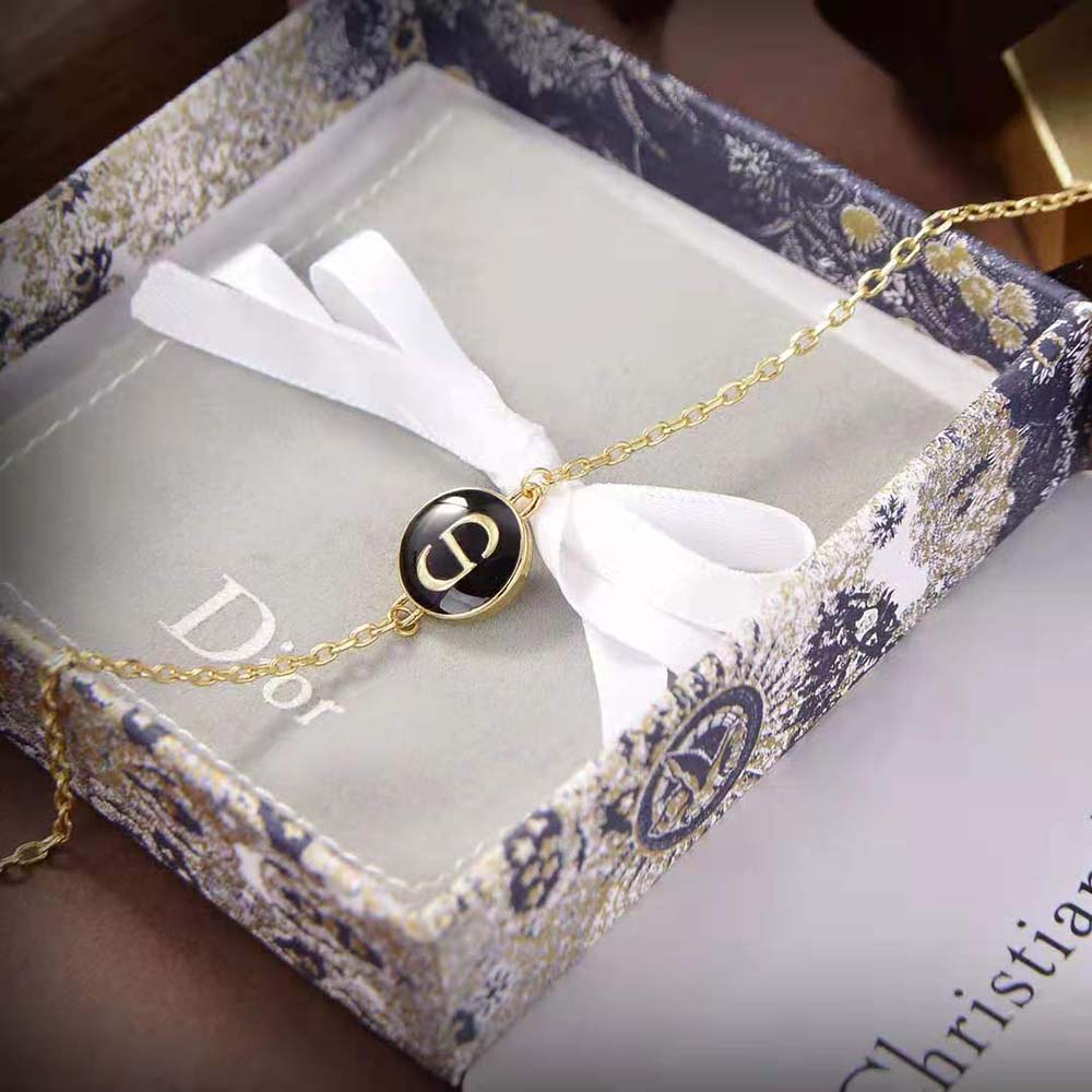 Side profile detail showing clasp and black lacquer on Dior Women Petit CD Bracelet