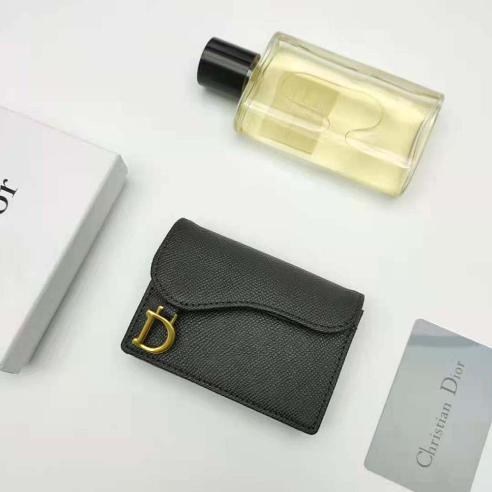 Close-up of Dior signature ‘CD’ hardware on card holder flap