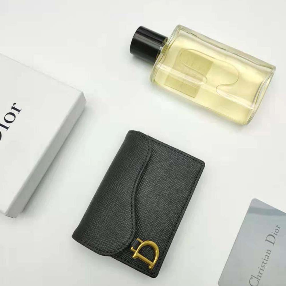 Side profile showing slim silhouette of Dior Women Saddle Flap Card Holder