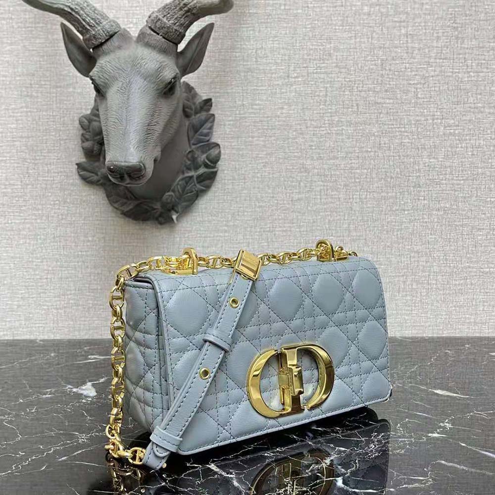 Side angle showing adjustable strap of Small Dior Caro Bag in cloud blue