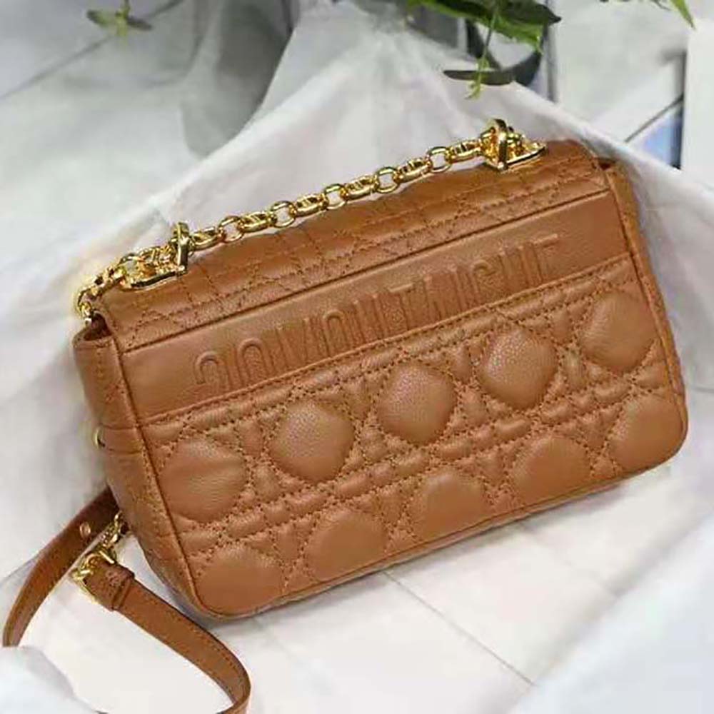 Side angle showing smooth leather and shoulder strap of Dior Women Small Dior Caro Bag