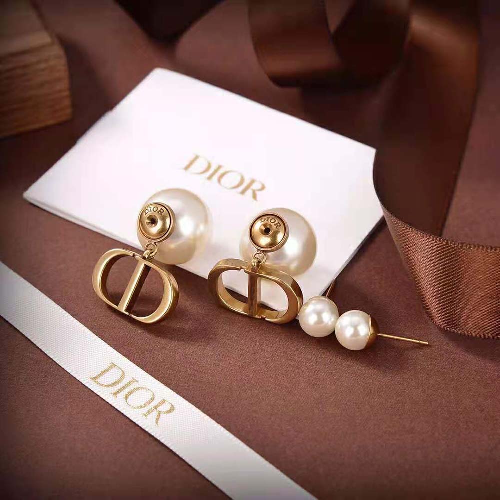 Close-up detail of antique gold finish on Dior Women Tribales Earrings