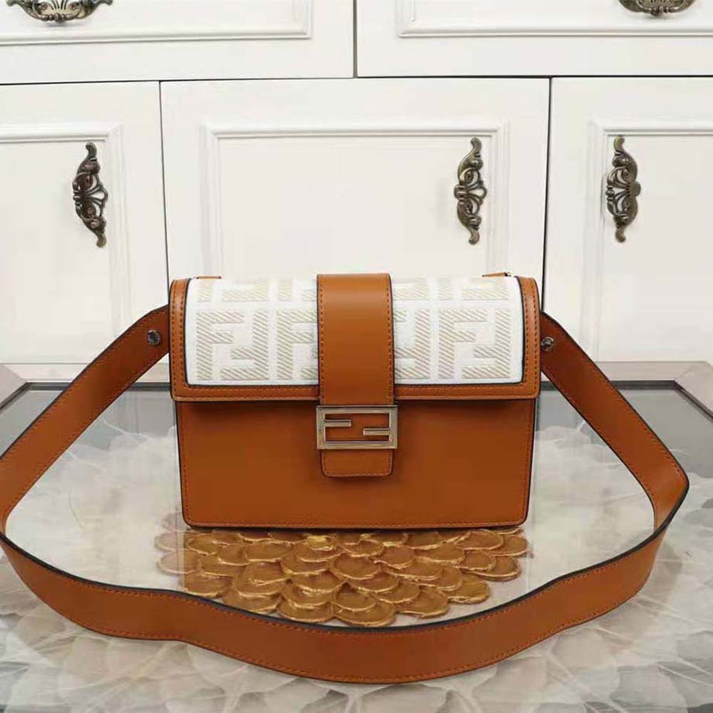 Close-up of gold-tone hardware on Fendi Men Flat Baguette Leather Bag-Brown