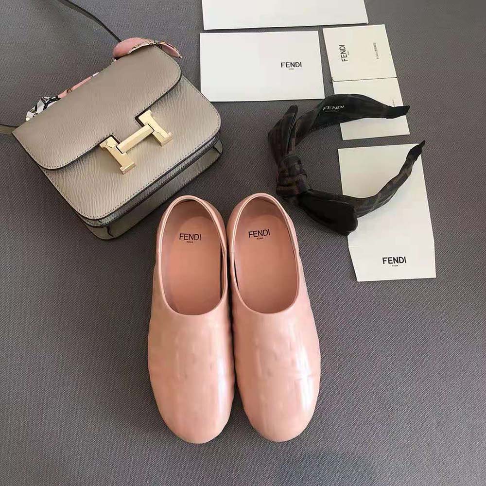 Close-up of Fendi logo hardware on pink nappa leather slippers