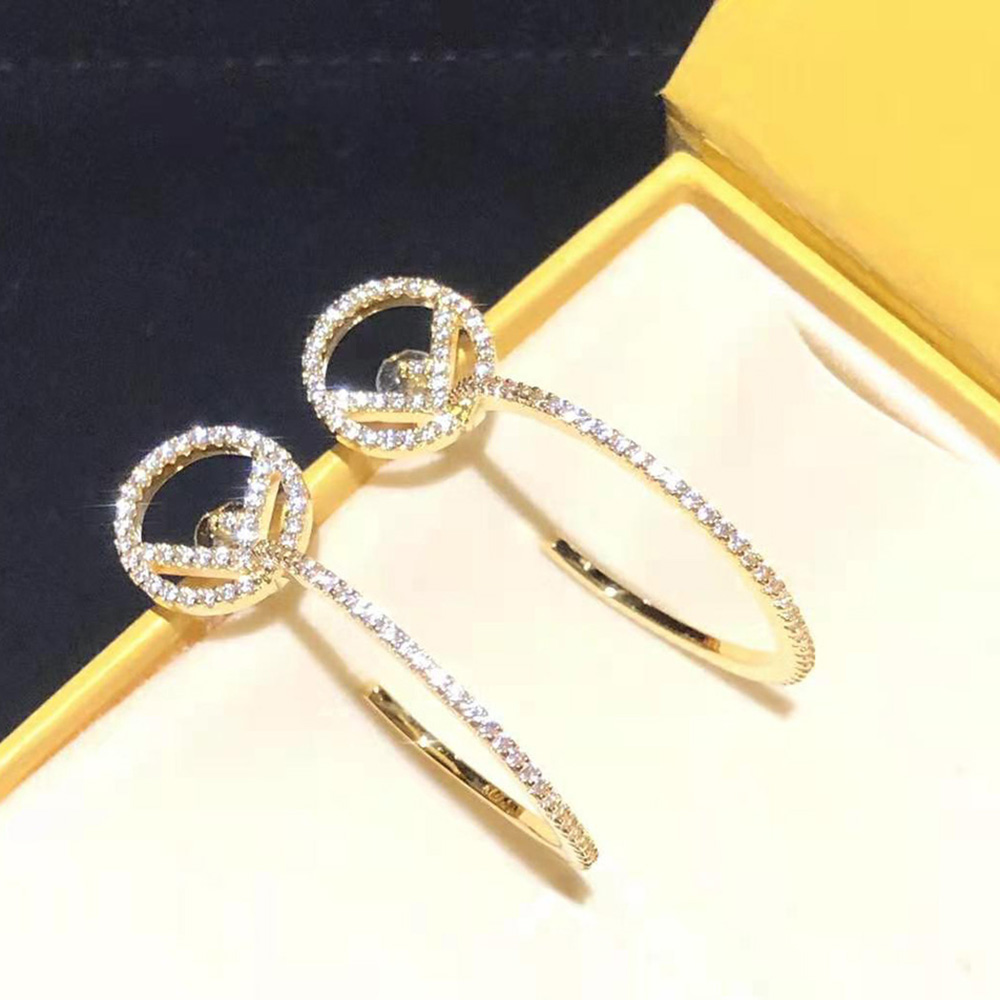 Close-up detail of gold-tone finish on Fendi Women F is Fendi Earring
