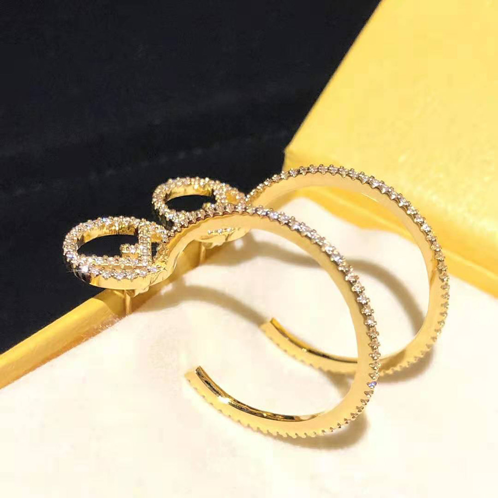 Side angle of Fendi Women F is Fendi Earring Gold-color with closure