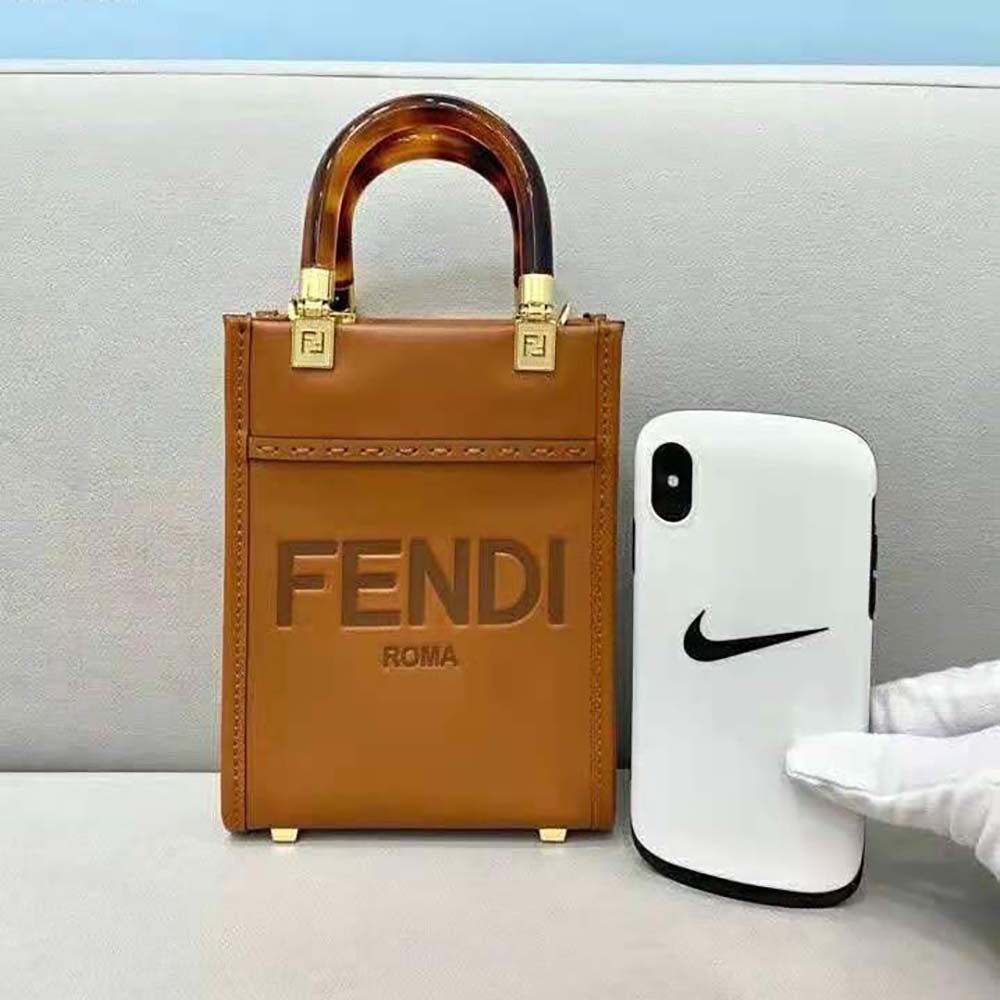 Close-up of gold-tone hardware on Fendi Women Mini Sunshine Shopper leather mini-bag