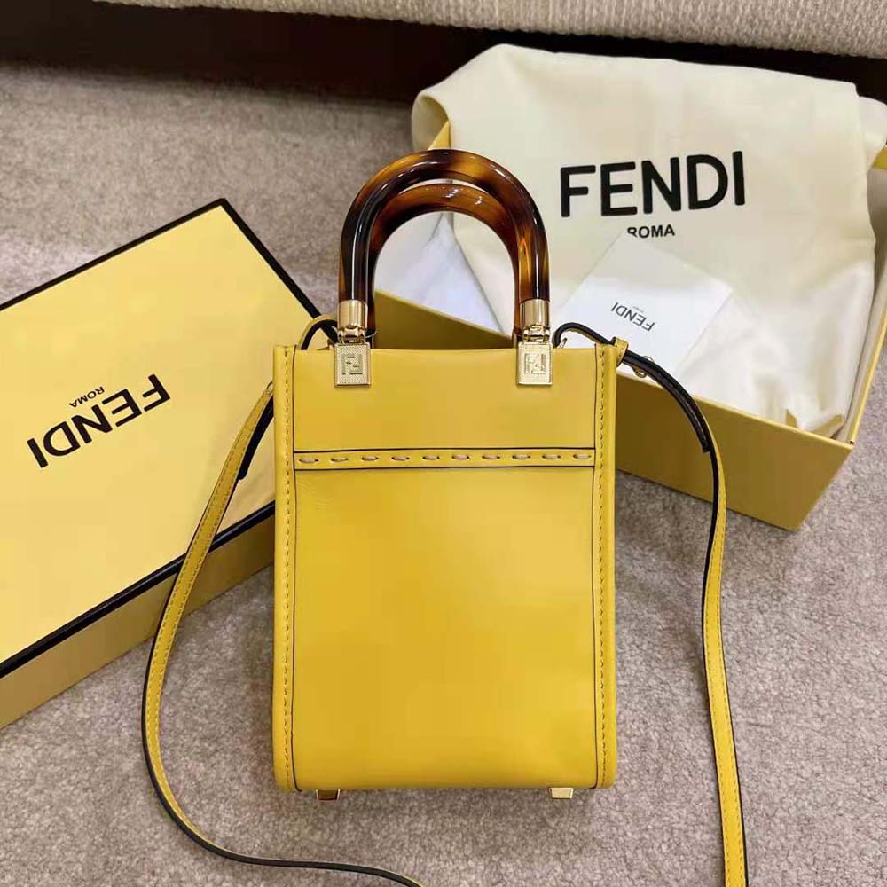 Side angle highlighting shape of Fendi Women Mini Sunshine Shopper Leather Mini-Bag-Yellow