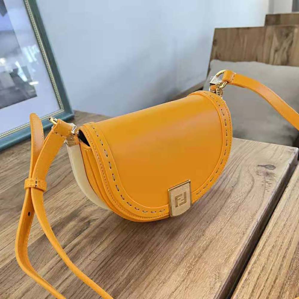 Side angle of Fendi Women Moonlight Orange Leather Bag showing silhouette