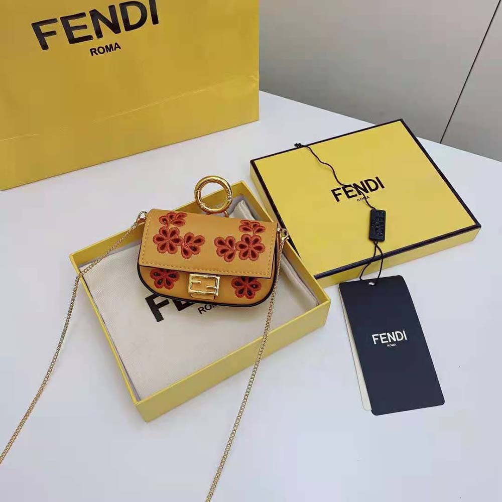 Close-up of gold hardware and signature charm on the Fendi bag