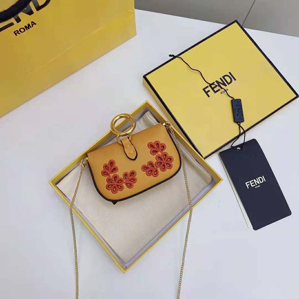 Side angle showcasing the compact shape of Fendi Women Nano Baguette Charm