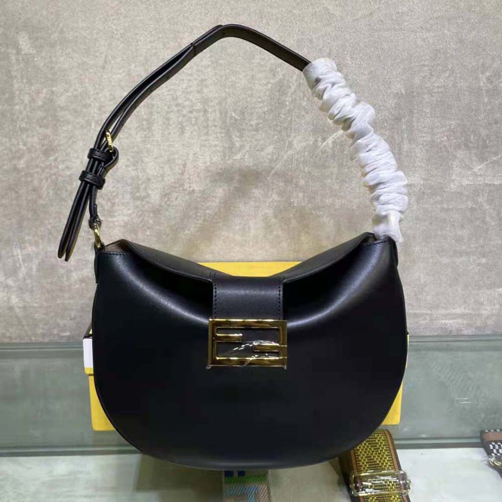Close-up of gold-tone hardware and zipper on Fendi Women Small Croissant Black Leather Bag
