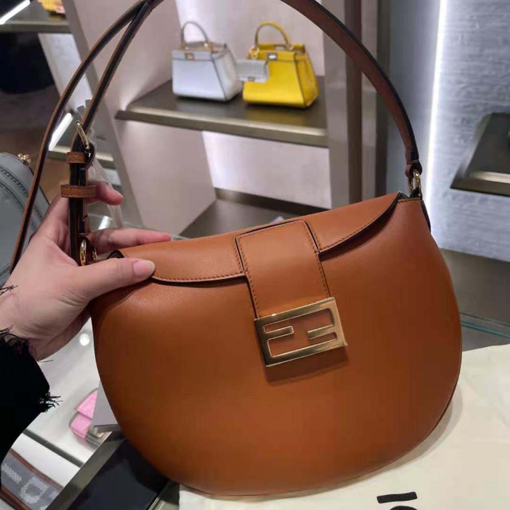 Close-up of gold-tone hardware and zip on Fendi Small Croissant Bag