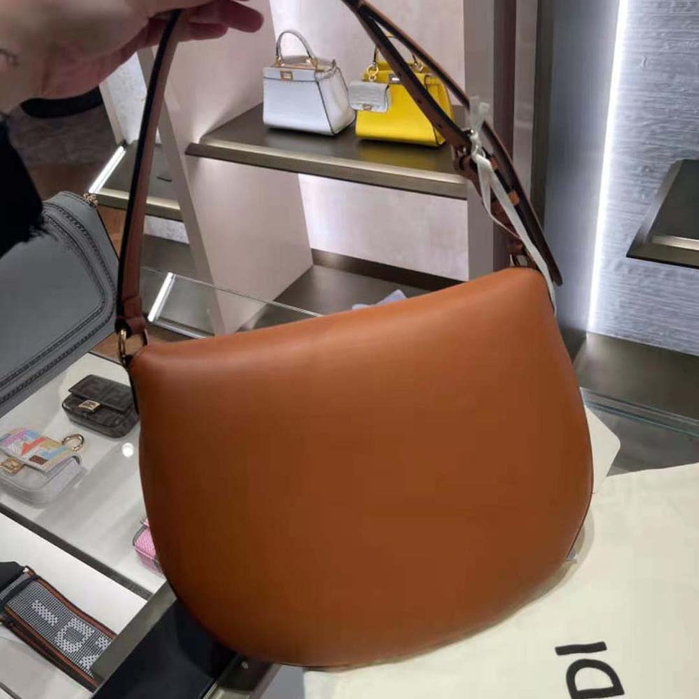 Side profile showing curved silhouette of Fendi Women Small Croissant Bag