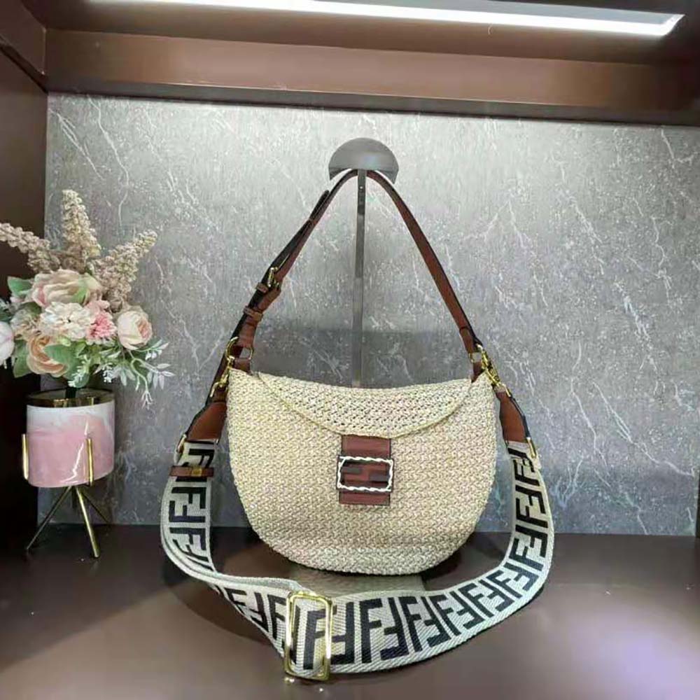 Close-up of woven straw and gold hardware on Fendi bag