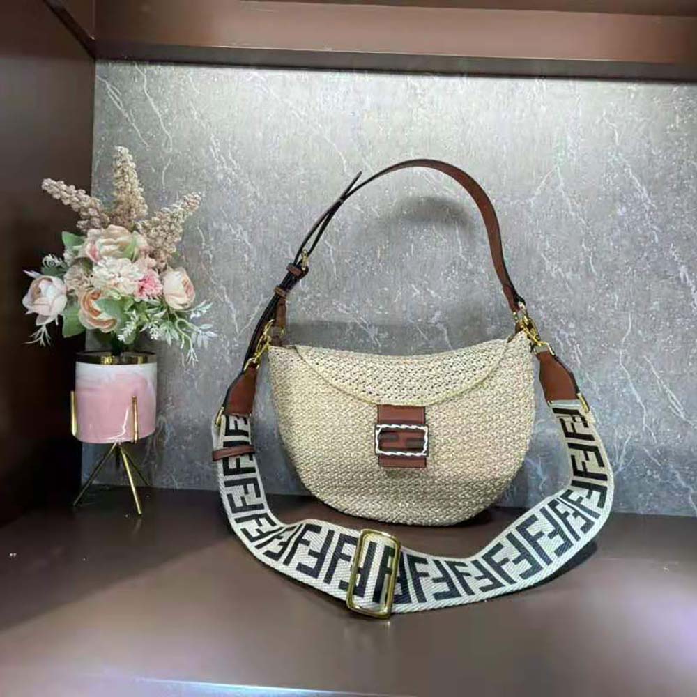 Side profile showing crescent shape of Fendi Straw Bag Beige