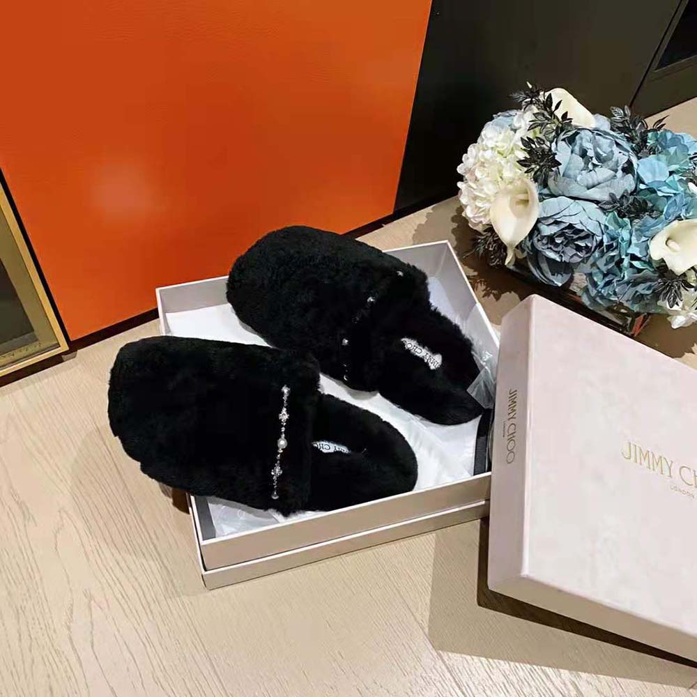 Close-up of natural shearling lining on Jimmy Choo Aliette slippers