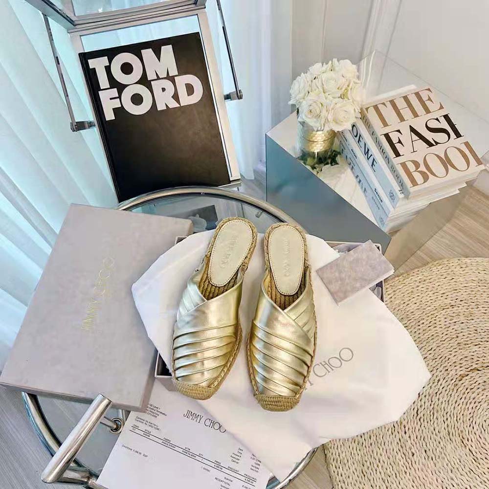 Close-up detail of gold-tone hardware on Jimmy Choo Women DES Flats espadrille
