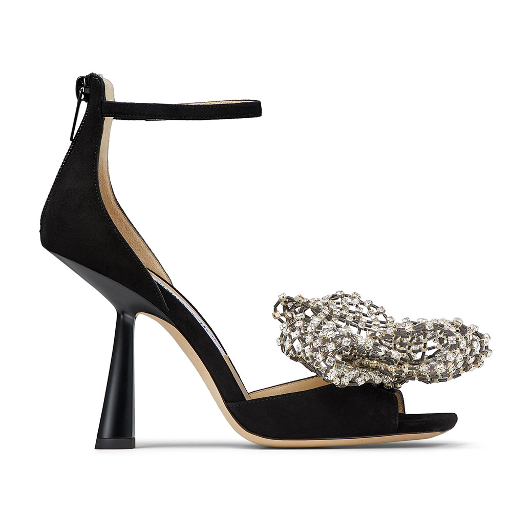 Side view of Jimmy Choo Women Mana 100 Black Suede Sandals with Crystal Bow Clasp