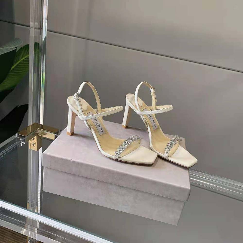 Top angle showcasing ankle strap and white nappa leather on Meira 85 sandals