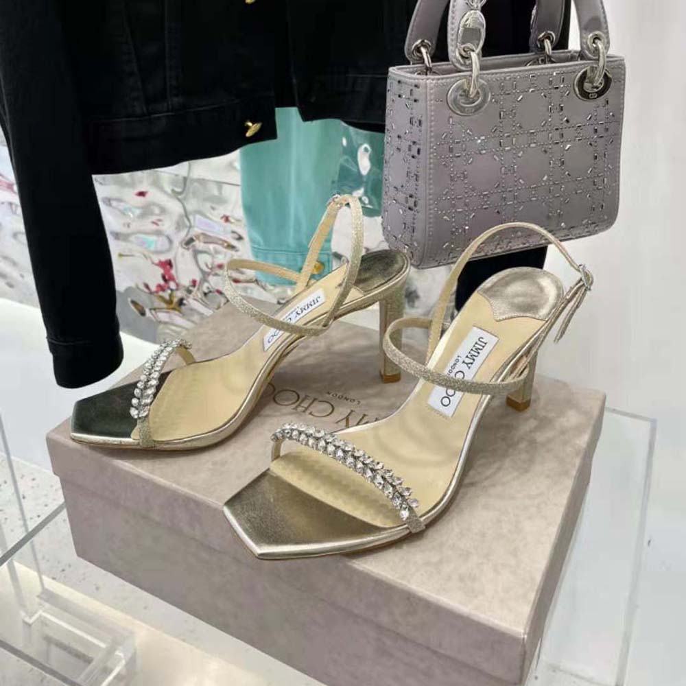 Back view showing buckle and heel of Jimmy Choo Women Meira 85 Platinum Lce Dusty Glitter Sandals
