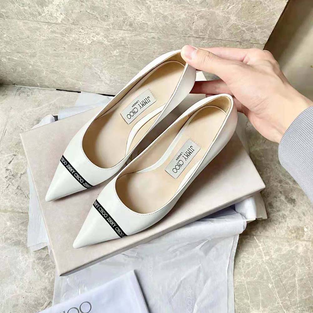 Close-up of logo-woven ribbon detail on Jimmy Choo RENE 65 pumps