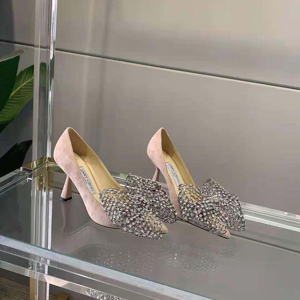 Top-down angle showing ballet pink suede texture on Jimmy Choo pumps