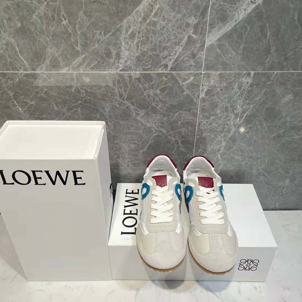 Close-up detail of Loewe embossed logo on blue calfskin sneaker