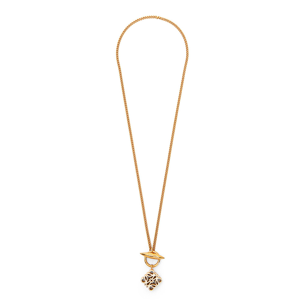 Close-up of Loewe Women Anagram Pendant Necklace in Metal showing signature gold Anagram